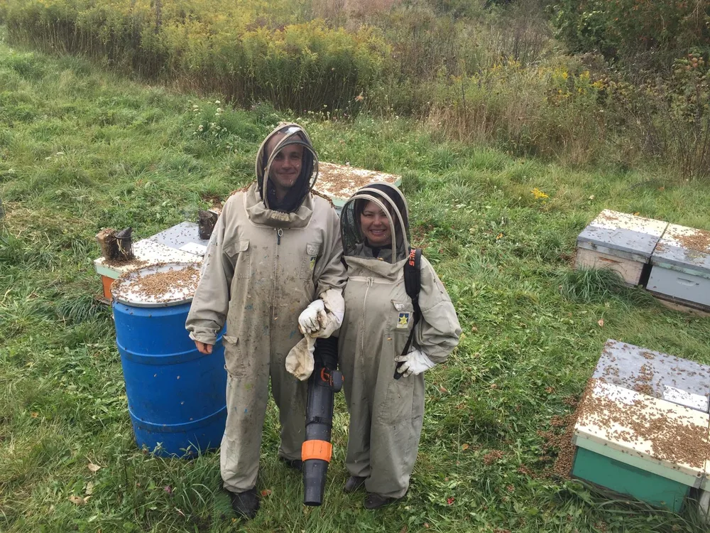Yauheni and Aliya at the Canadian Dream Honey apiary in Erin